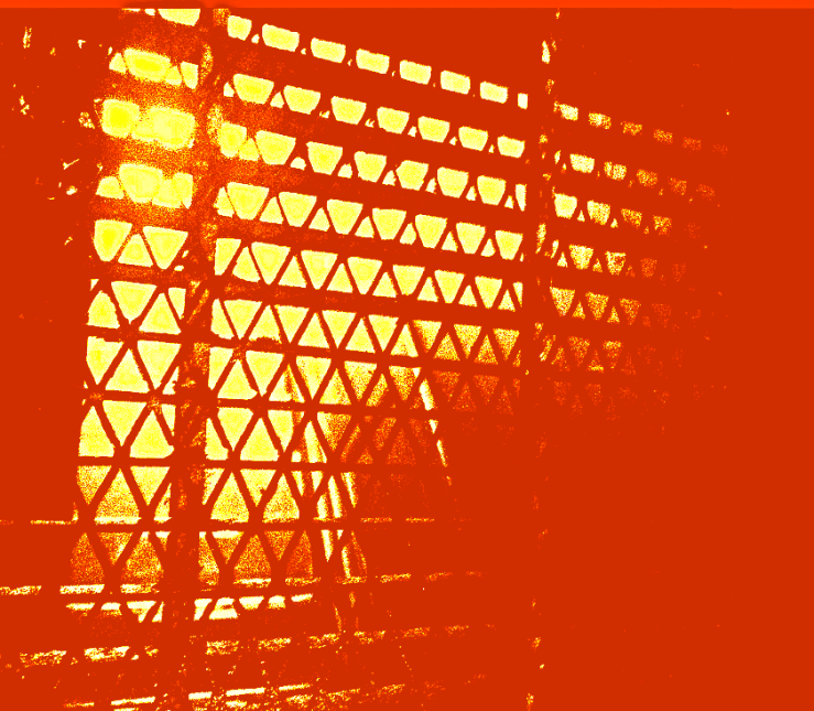 Yellow and scarlet colours / a window with metal triangular mesh. "Waking to Run" (c) 2025 Robert Frede Kenter 