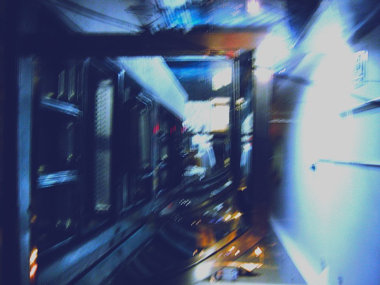 A distorted, disordered corridor in shades of carbon blue.