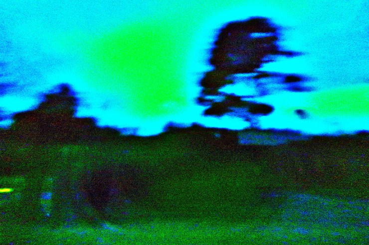 A field, a tree, distorted collage in dark blues, turquoise shades of green. an image collage by Robert Frede Kenter
